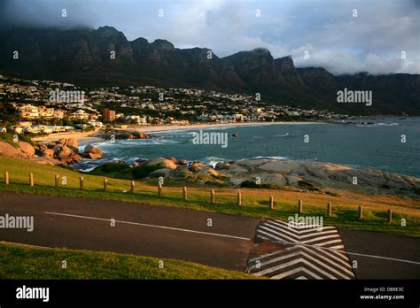 sunset at Maidens Cove and camps Bay with Table Mountain and the Twelve Apostles in the ...