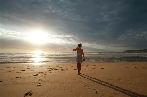 Woman Walking Along The Beach Photograph by Courtneyk - Fine Art America