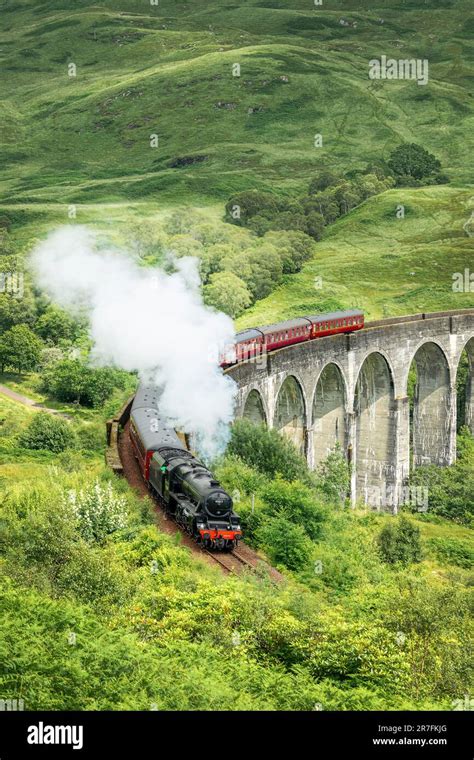 The Jacobite steam train on Glenfinnan viaduct in North West Highlands, Scotland, UK. The train ...