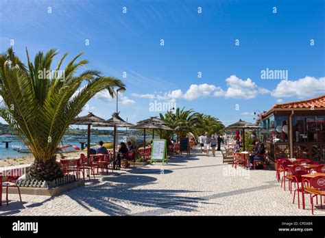 Seafront restaurants by the harbour in the resort of Alvor, near ...