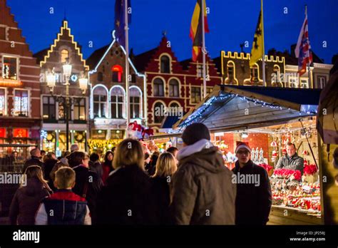 Christmas market stalls in the main square in bruges hi-res stock ...