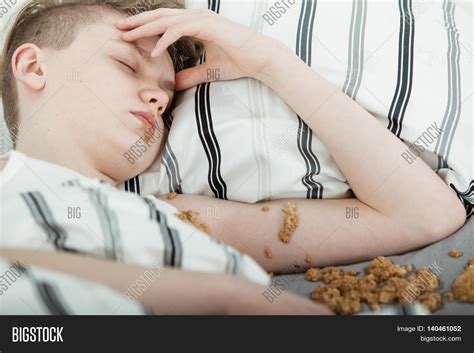 Teenage Boy Lying Bed Covered Vomit Image & Photo | Bigstock