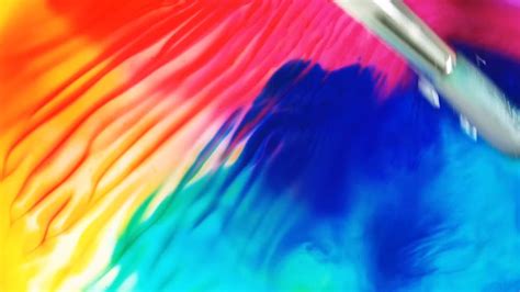 A Person Mixing Liquid Colors · Free Stock Video