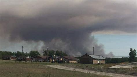 Most of Poplar River First Nation forced from homes by forest fire | CBC News