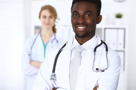 Happy African American Male Doctor with Medical Staff at the Hospital Stock Photo - Image of ...