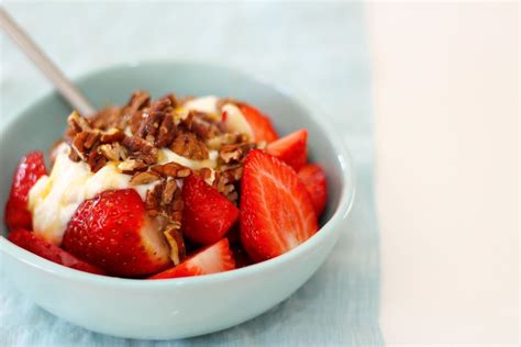 Organic strawberries with cinnamon spiked Greek yoghurt, raw honey, coconut and activated pecans ...