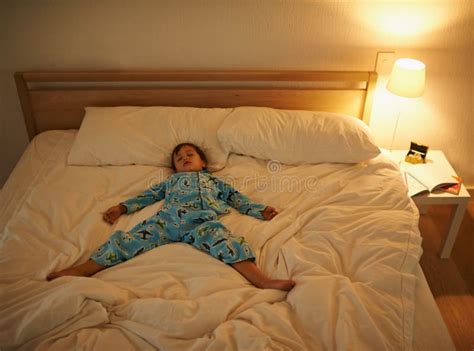 He always Sleeps so Peacefully. a Young Boy Sleeping in Bed. Stock ...