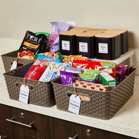 two baskets filled with snacks on top of a counter