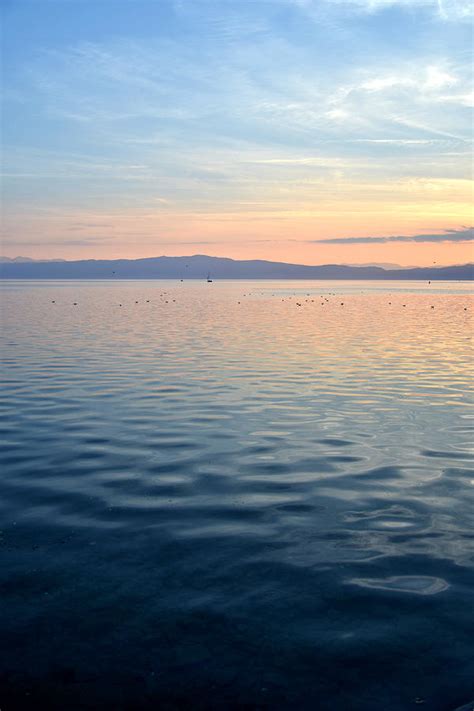 Sunset at lake Ohrid in North Macedonia Photograph by Elena ZapasskyBaal - Fine Art America