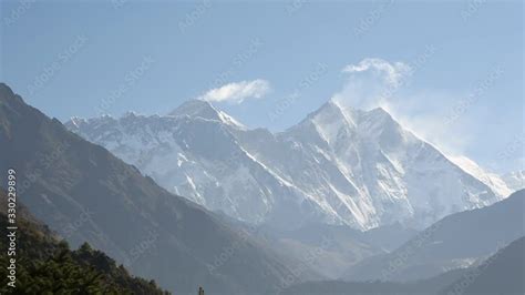 Light clouds forming off peak of Mount Everest in the distance Stock Video | Adobe Stock