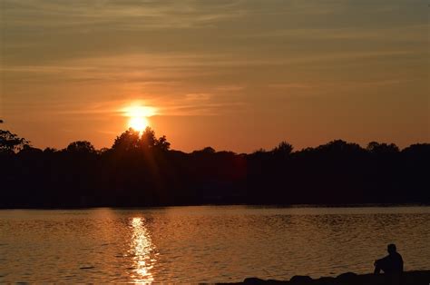 Sunset,lake,silhouette,man sitting,shore - free image from needpix.com