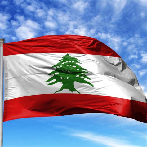 National flag of Lebanon on a flagpole in front of blue sky – Cedar Routes