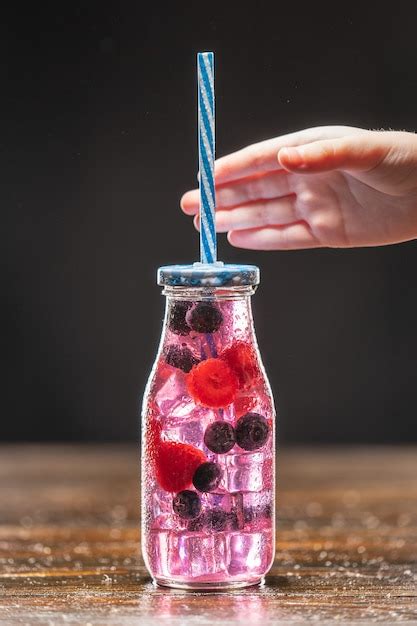 Premium Photo | Fruit infuser water bottle with straw and fruits