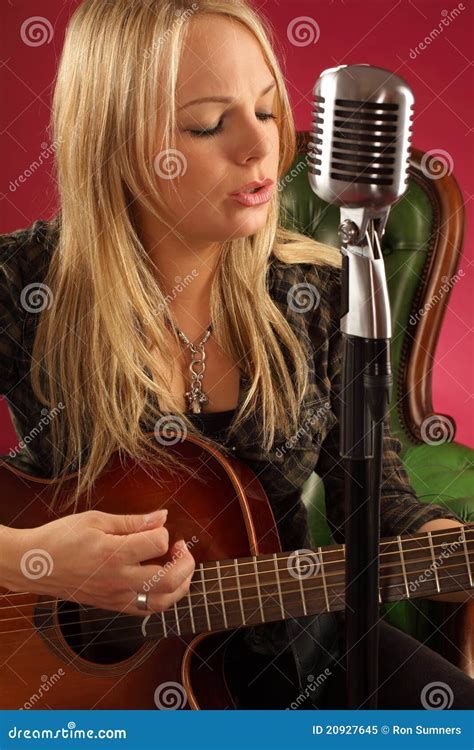 Blond Female Playing Acoustic Guitar Royalty Free Stock Photo - Image: 20927645