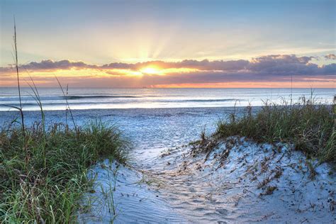 Sunrise Glow in the Sand Dunes Photograph by Debra and Dave Vanderlaan ...