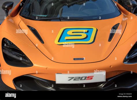 Orange bonnet of a classic McLaren racing car with and S logo seen close up Stock Photo - Alamy