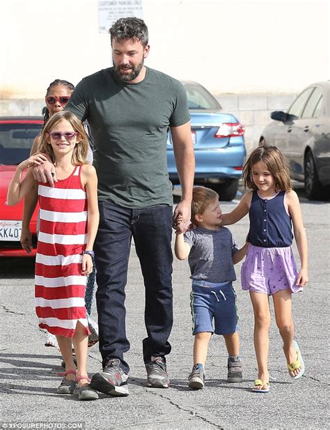 Ben Affleck holds hands with his three children as they enjoy low key ...