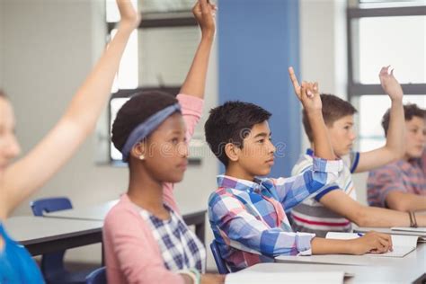 Student Raising Hand in Classroom Stock Photo - Image of education, answering: 87389414