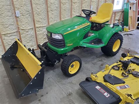 John Deere X585 4x4 Garden Tractor & Attachments - ReGreen Equipment