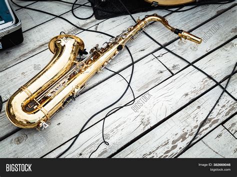 Saxophone On Wooden Image & Photo (Free Trial) | Bigstock