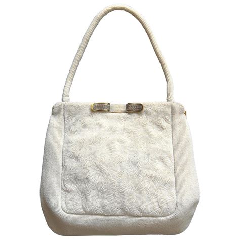 A white micro beaded evening bag, for Saks Fifth Avenue, France, 1950s. For Sale at 1stdibs