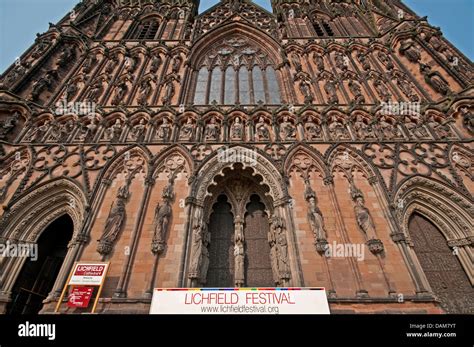 Lichfield Cathedral with banners ready for the 2013 Lichfield Festival taken from low angle to ...