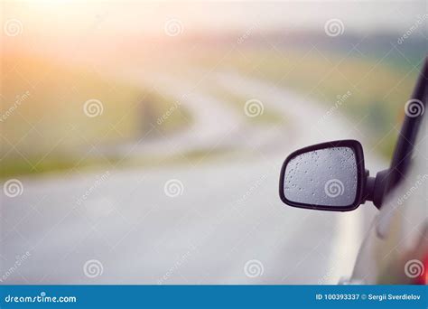 Rear view mirror at sunset stock image. Image of rearview - 100393337