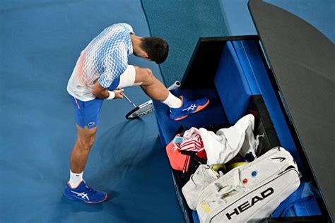 Novak Djokovic defies injury amid 'disgraceful' scenes at Australian Open