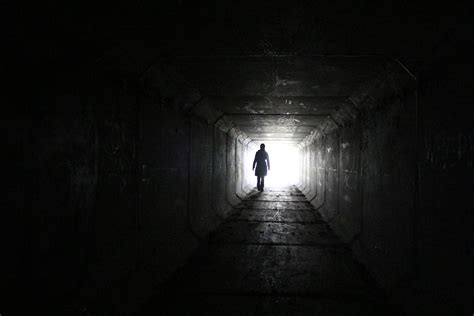 Person walking inside dark tunnel with white light on far distanc HD wallpaper | Wallpaper Flare