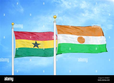 Ghana and Niger two flags on flagpoles and blue sky Stock Photo - Alamy