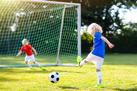 Kids Play Football Child At Soccer Field Stock Photo - Download Image ...