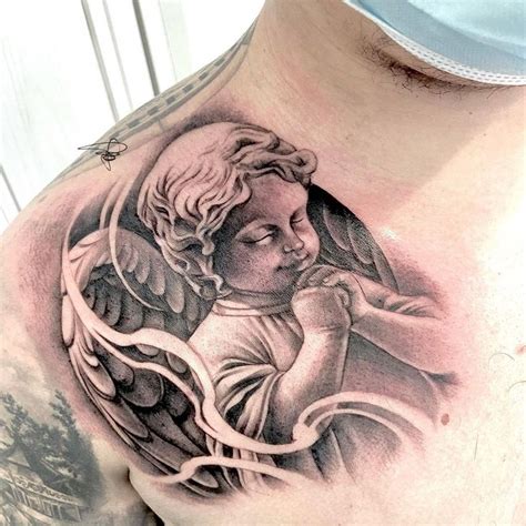 Shoulder Grace: Praying Baby Angel Tattoo - Serenity and Inspiration in ...