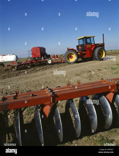 APPLYING DRY FERTILIZER AND ANHYDROUS AMMONIA TOGETHER, ON GROUND PRIOR TO CORN PLANTING ...