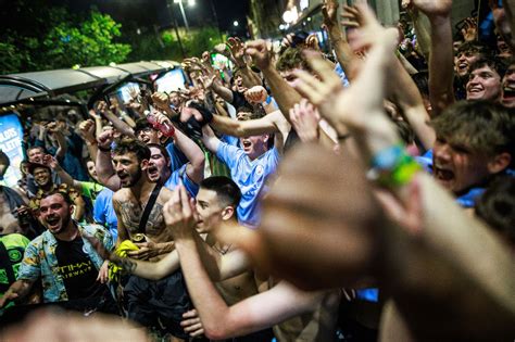 In pictures: Elated Manchester City fans celebrate into night after ...