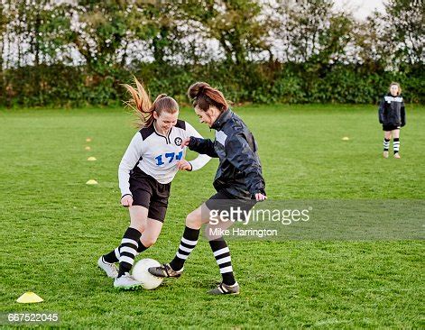 Two Female Footballers Practicing Skills High-Res Stock Photo - Getty Images