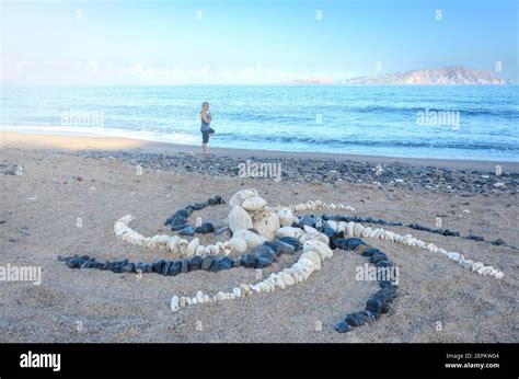 Man meditating on the beach Stock Photo - Alamy