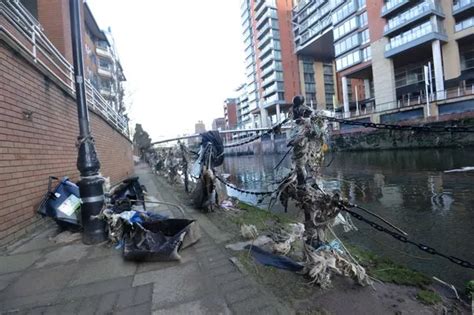 River Irwell flooding: Pictures that show it's still a mess after deluge dragged branches ...