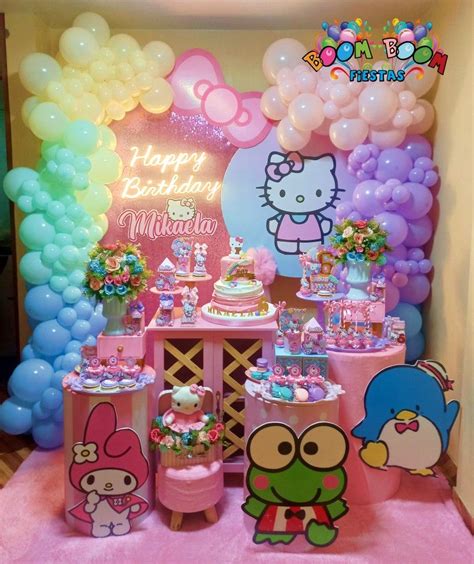 a hello kitty birthday party with balloons and decorations