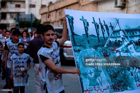 Members of Syria's Syriac Christian minority attend a ceremony to ...