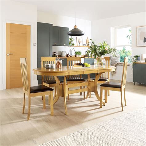 Townhouse Oval Oak Extending Dining Table with 6 Oxford Light Chairs (Brown Leather Seat Pads ...