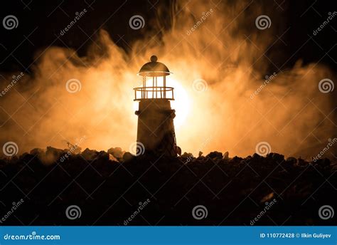 Lighthouse with Light Beam at Night with Fog. Stock Photo - Image of ...