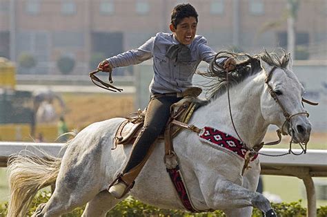 A Mexican Charro rides his horse during Pictures | Getty Images