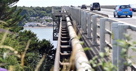 One dead and another critical after coach and car crash near Welsh bridge - North Wales Live