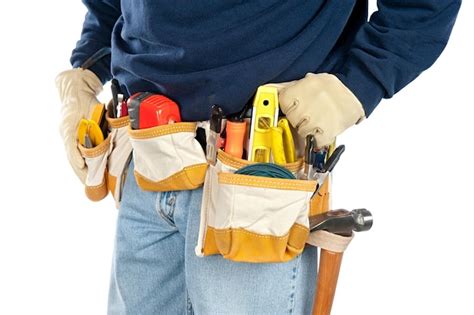 Premium Photo | A skilled tradesman stands with his fully loaded tool ...