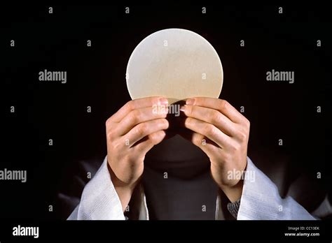 Consecration of The Eucharist During Mass Stock Photo - Alamy