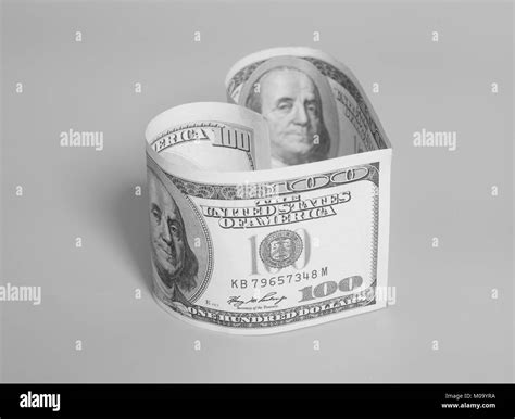 100 dollar bill in heart shape Black and White Stock Photos & Images - Alamy