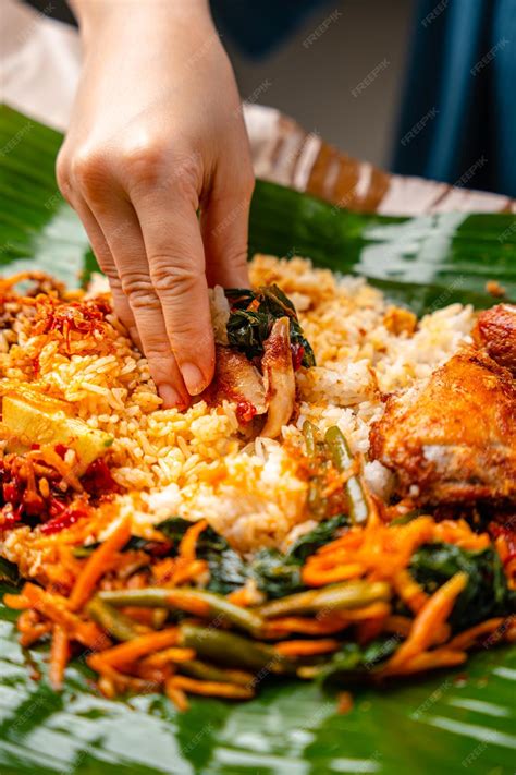 Premium Photo | Indonesian padang food or nasi bungkus with padang fried chicken indonesia ayam ...