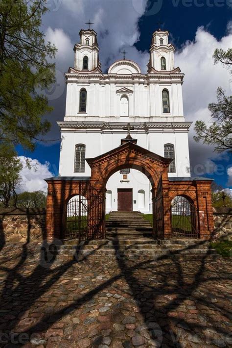 A White Catholic Church on a Summer Day With Dark Clouds in the Background 15185701 Stock Photo ...