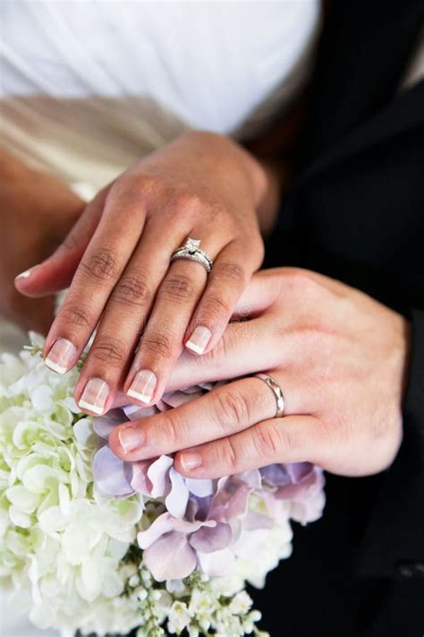 Bride And Groom Wedding Rings Stock Photo - Image of couple, bouquet ...