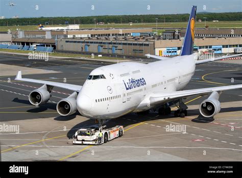 Lufthansa Boeing 747 Jumbo jet escorted to a gate at Frankfurt-Main ...